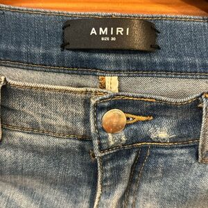 AMIRI DISTRESSED SKINNY JEANS